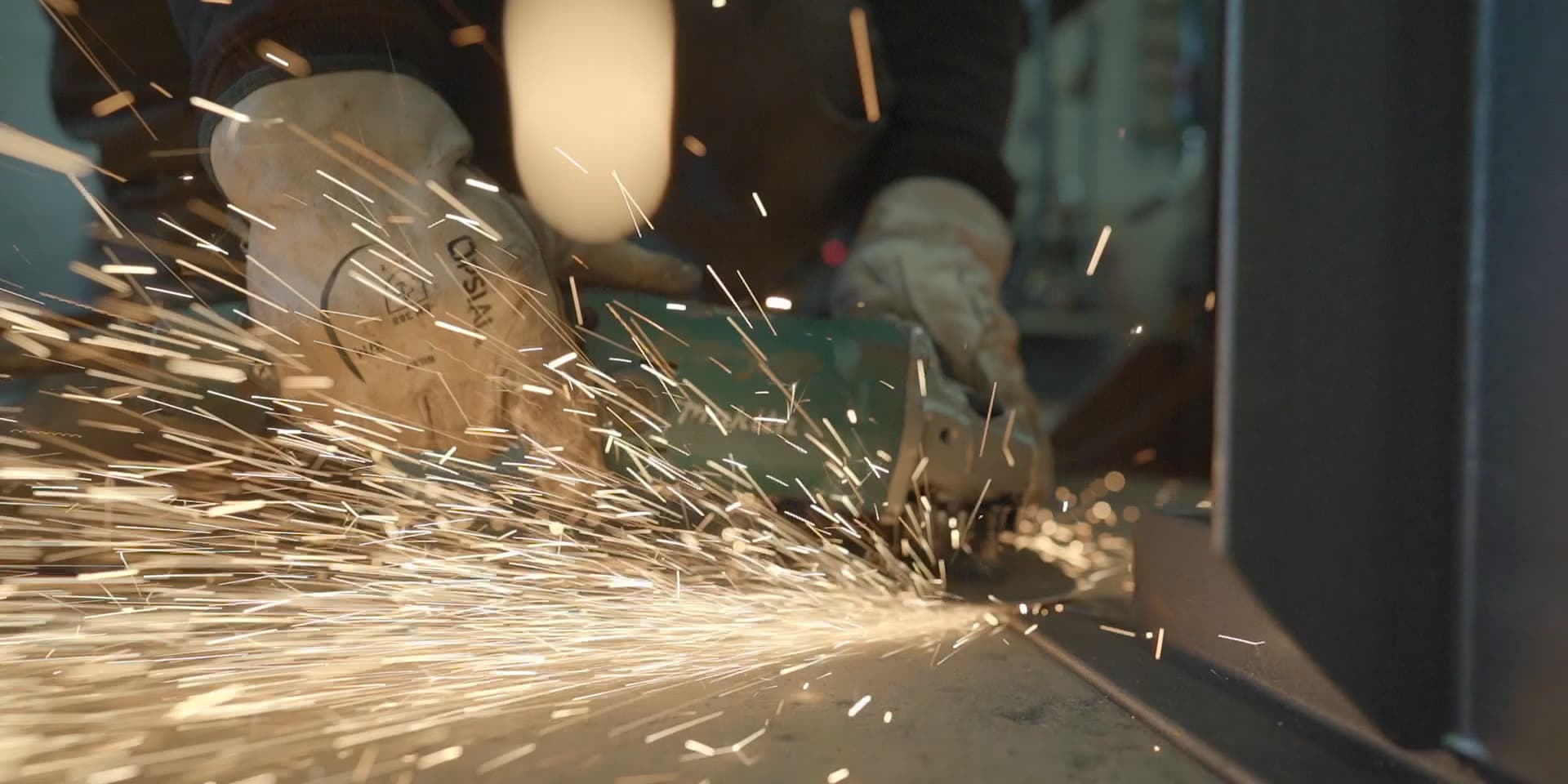 Grinding welds on the bench, sparks flying