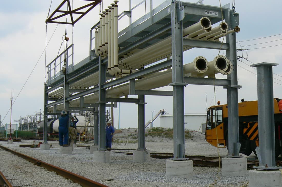 Galvanized pipe rack module being set on site